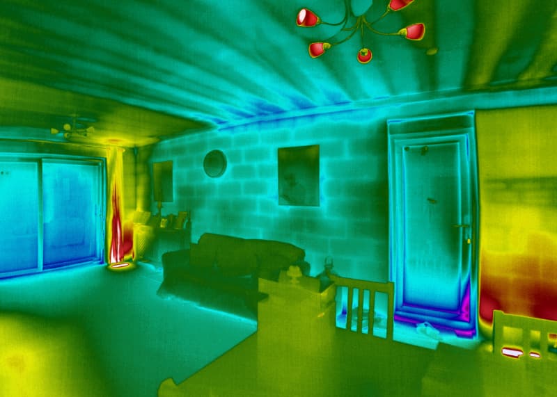 Thermal image showing poor air tightness behind plasterboard, from an infrared survey